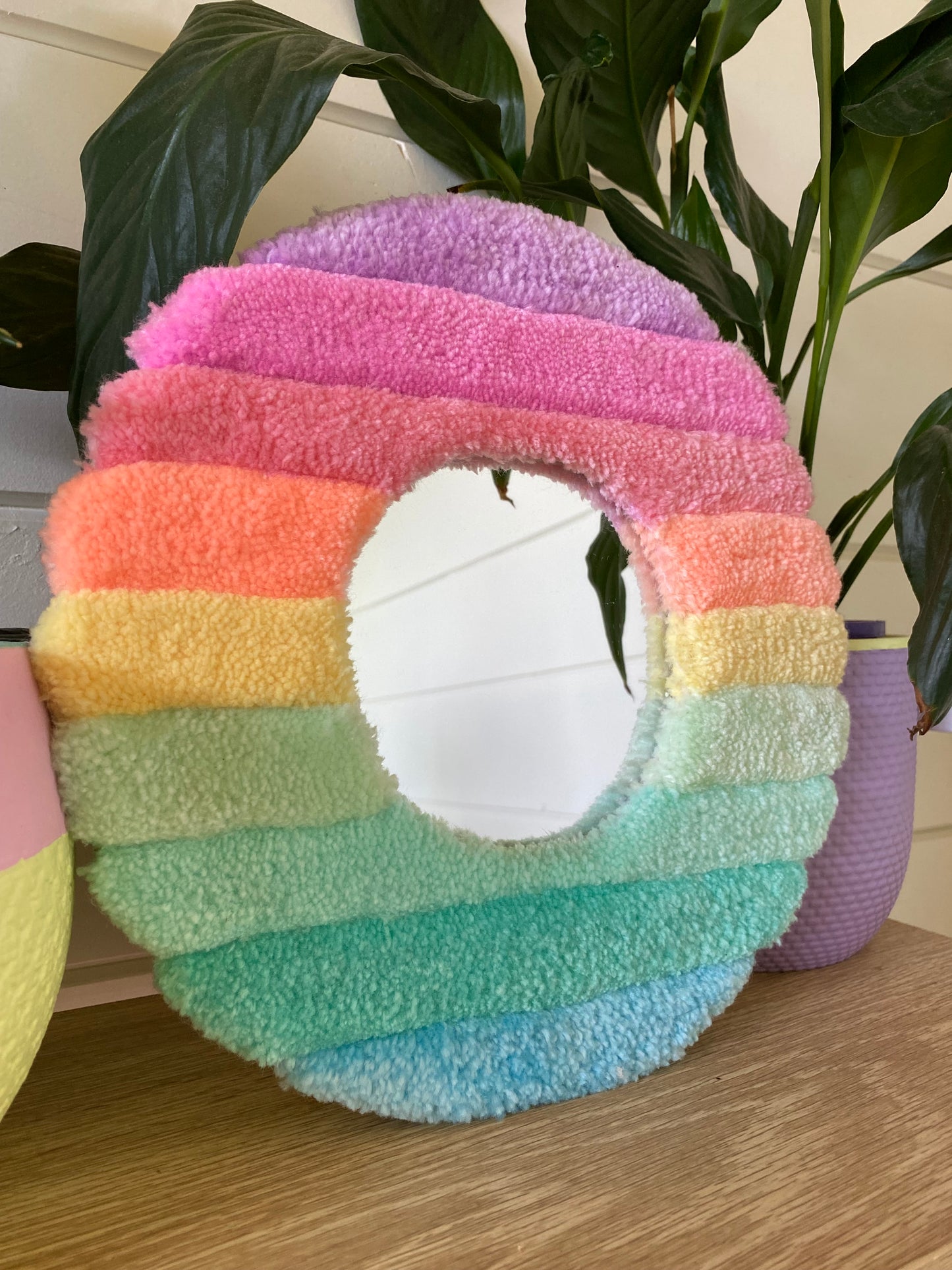 Cute pastel fluffy mirror with 3D stripes.