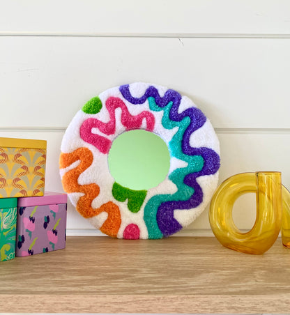 Happy retro squiggle design tufted mirror.