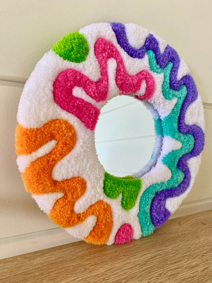 Happy retro squiggle design tufted mirror.