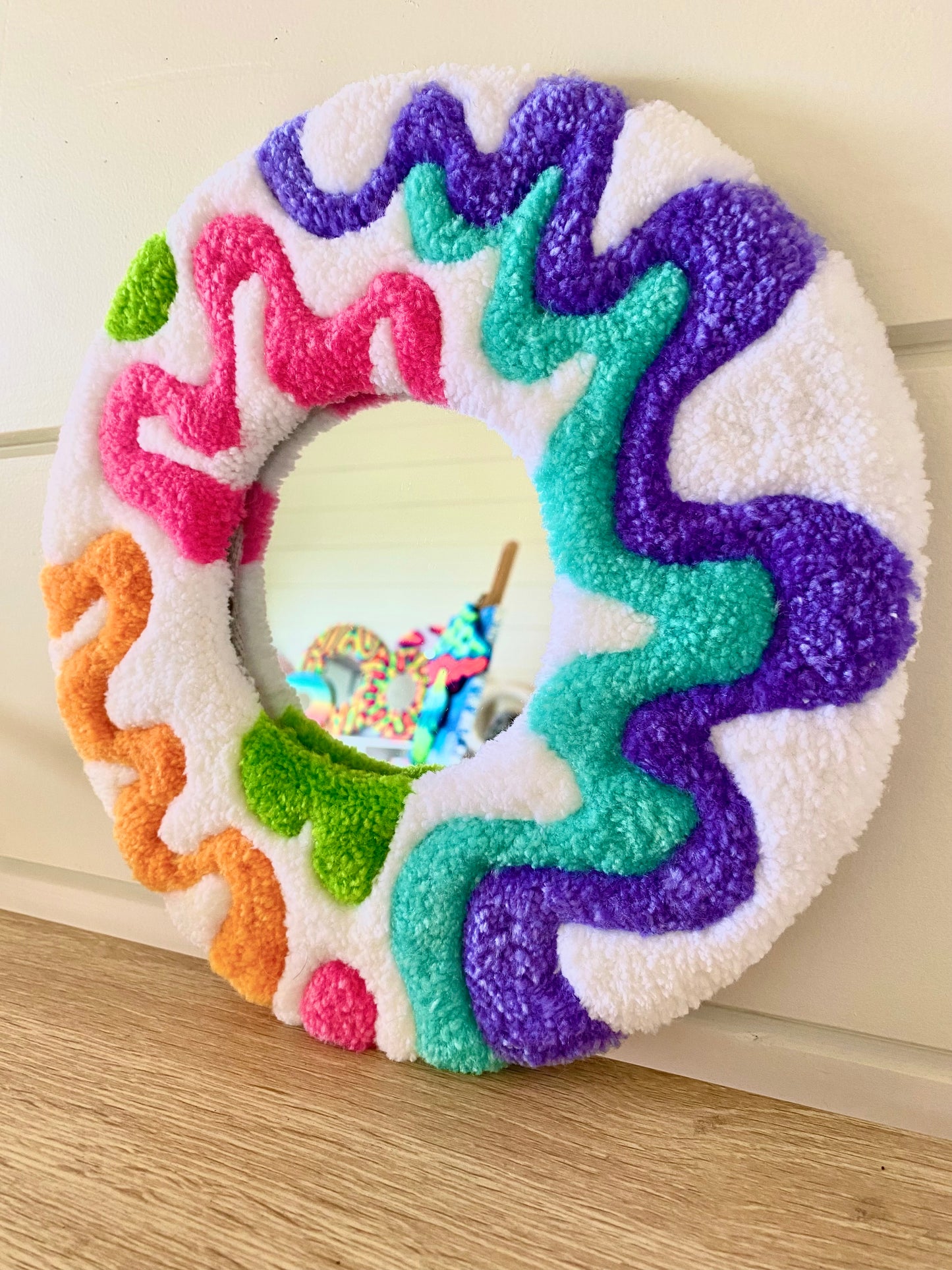 Happy retro squiggle design tufted mirror.