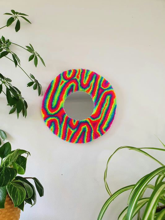 Miniature round psychedelic swirl mirror in rainbow with pink