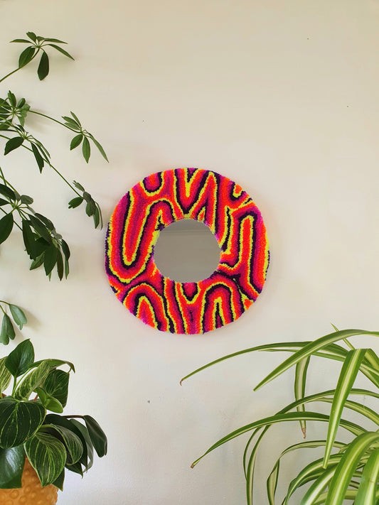 Miniature round psychedelic swirl mirror in neon dusk colours