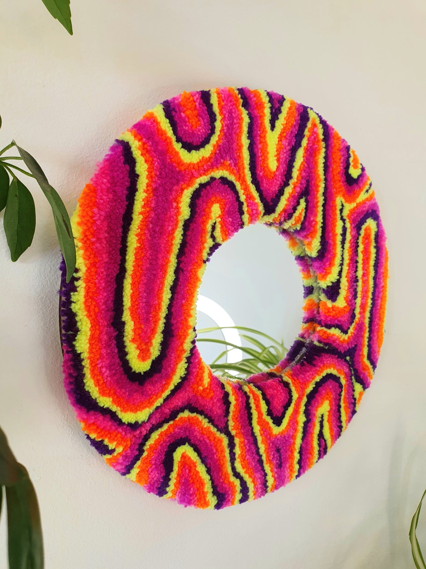 Miniature round psychedelic swirl mirror in neon dusk colours